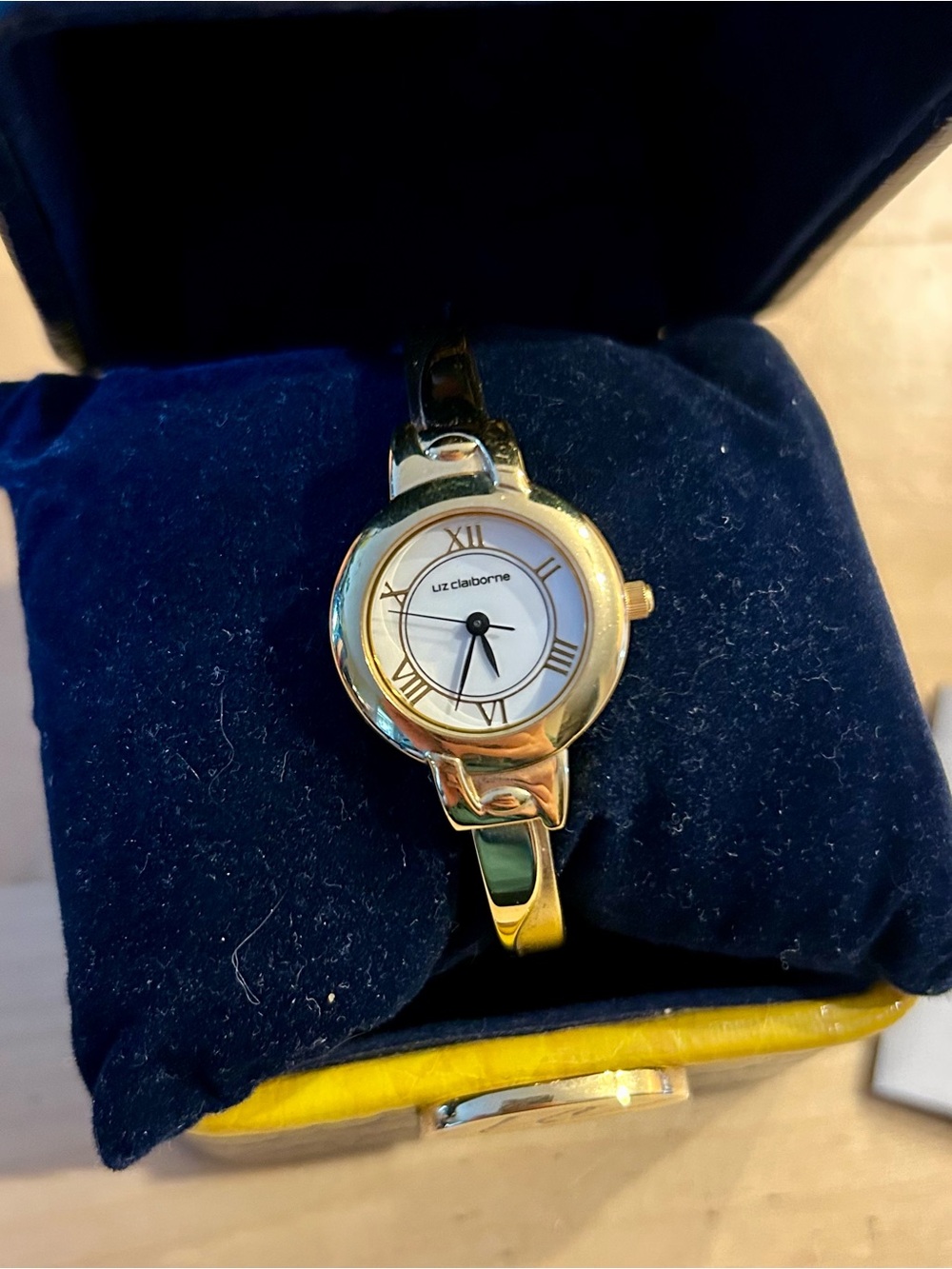 Liz Claiborne Gold Tone Bangle Watch with White Dial